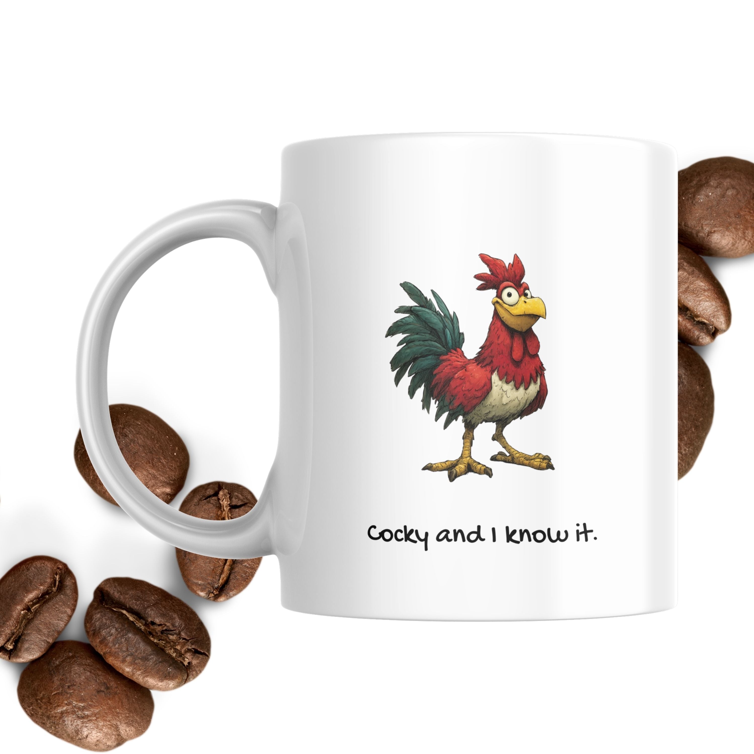 White mug with a rooster design and text, surrounded by coffee beans on a white background