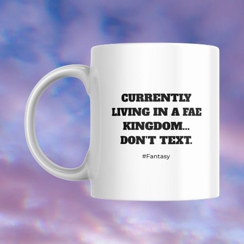 White mug with black text on a colorful abstract background