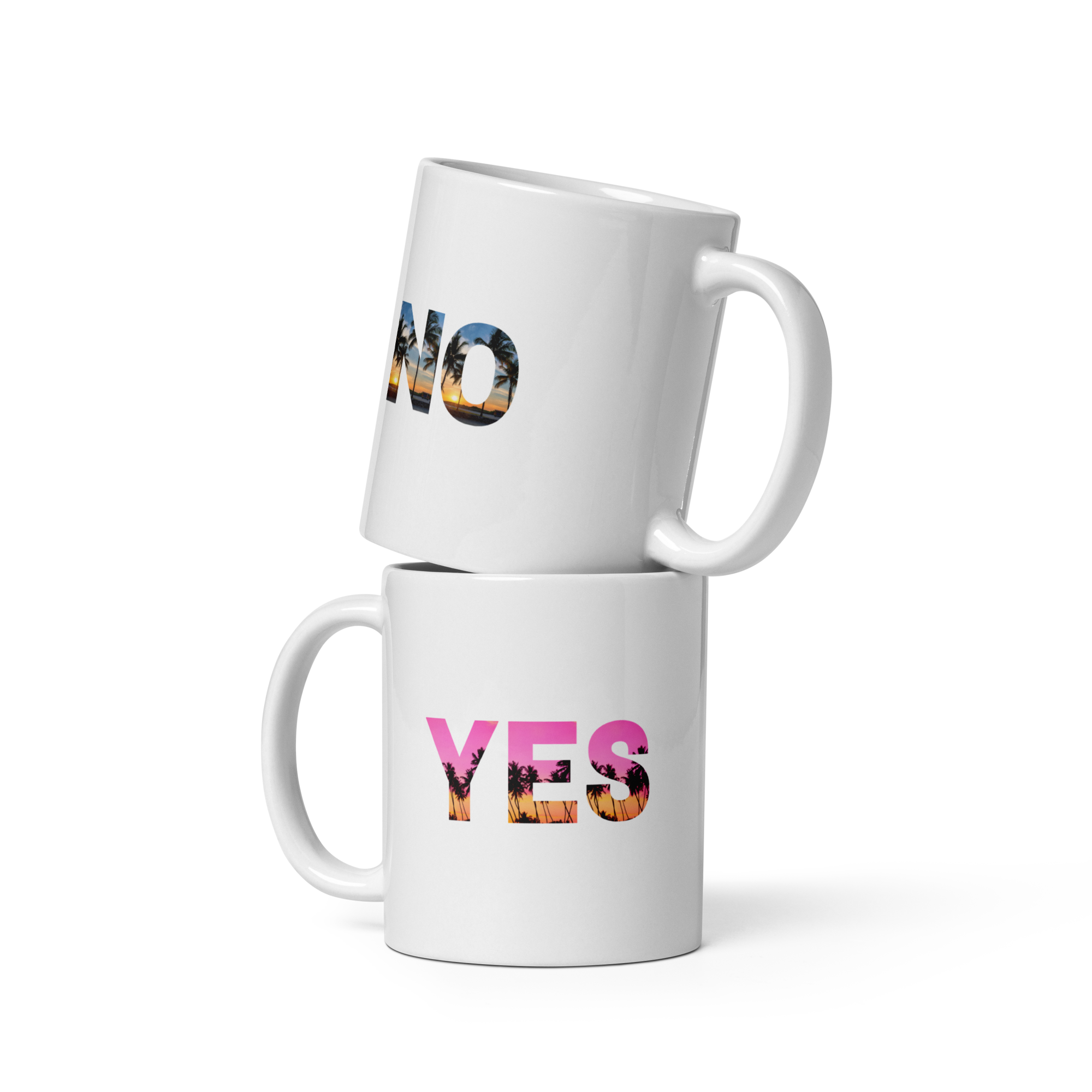 Two white mugs stacked on top of each other with colorful text on a white background