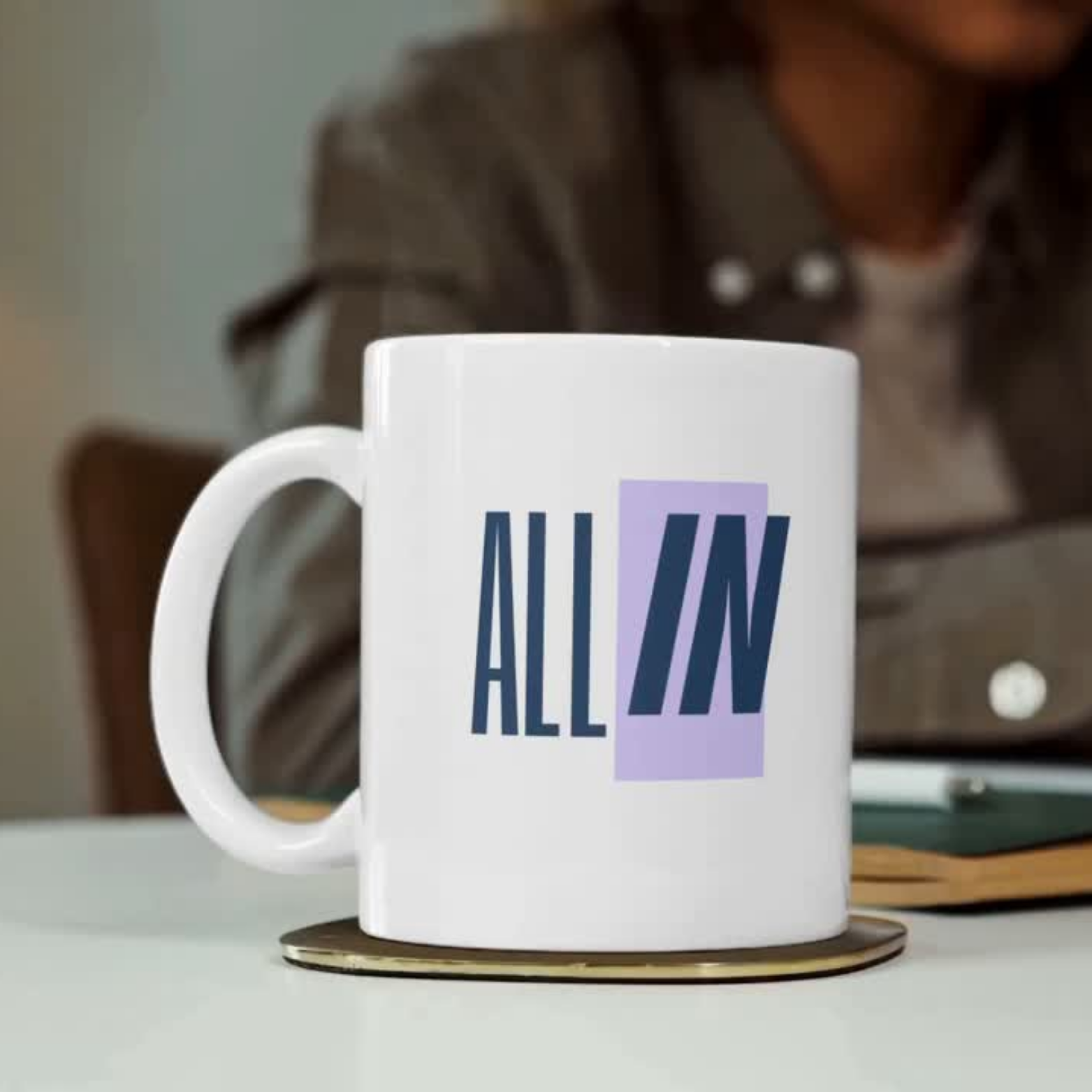 White ceramic mug with “ALL IN” printed in navy and lilac – motivational gift for entrepreneurs, founders and risk takers.