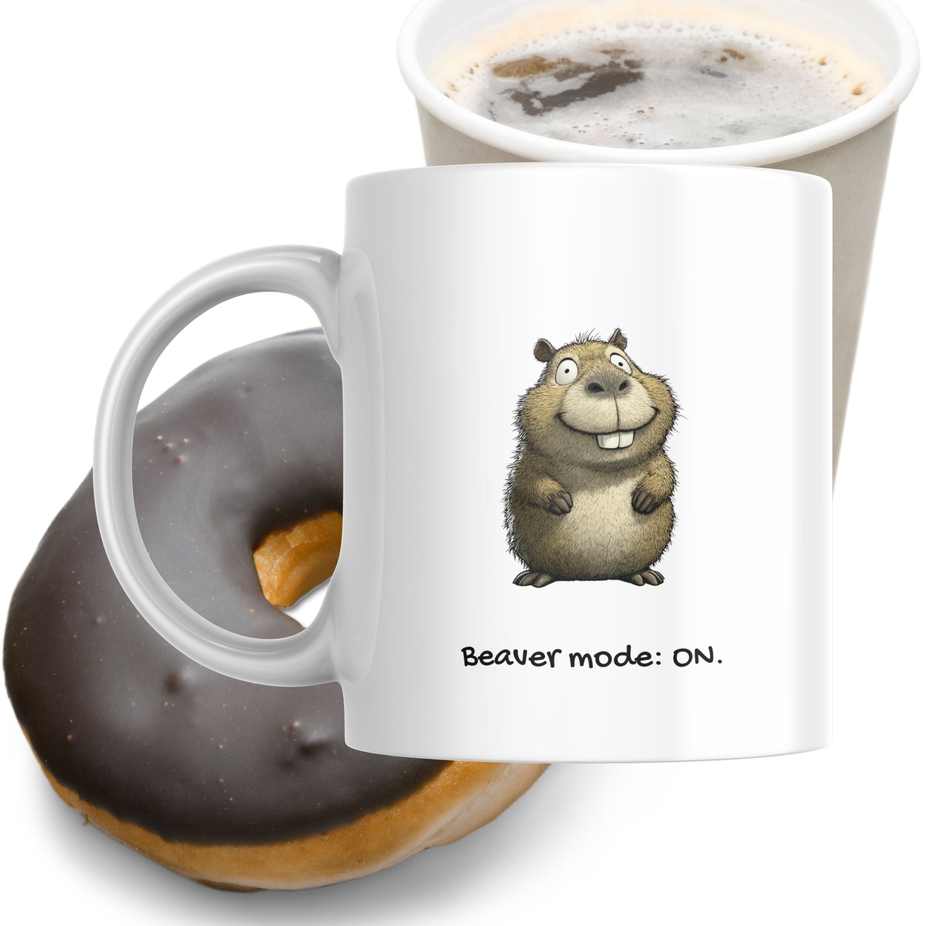 White mug with a cartoon beaver design and 'Beaver mode: ON.' text, next to a cup of coffee and donut.