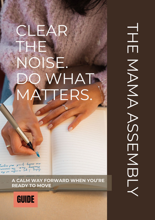 Person writing in a notebook with text overlay 'Clear the noise. Do what matters.' and 'The Mama Assembly' branding.
