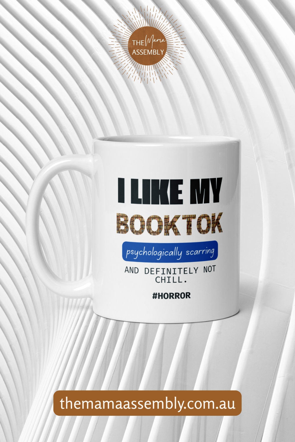 White mug with text 'I LIKE MY BOOKTOK psychologically scoring and definitely not chill. #Horror' on a white background with 'themamaassembly.