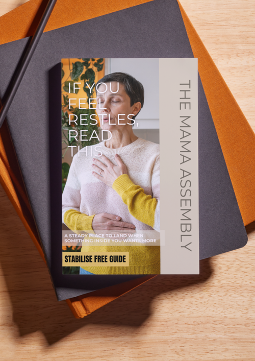 Book titled 'If You Feel Restless Read This' by The Mama Assembly on a wooden surface