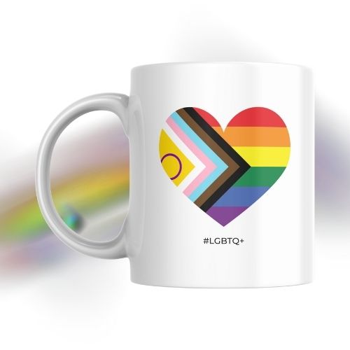 White mug with a rainbow heart design and '#LGBTQ+' text on a white background