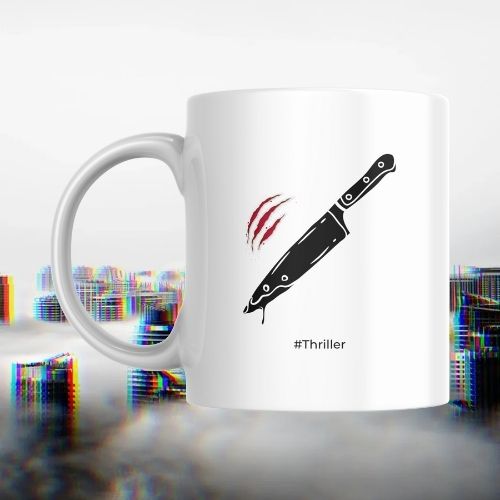 White mug with a knife graphic and '#Thriller' text on a white background