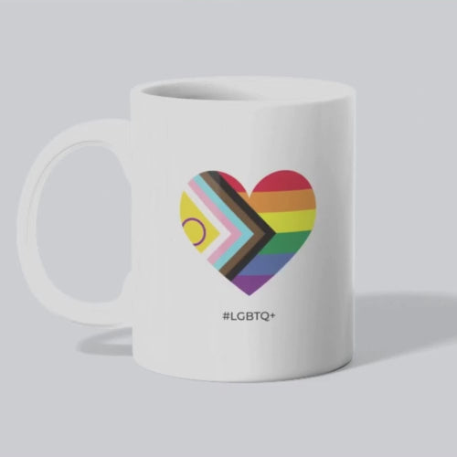 White mug with a rainbow heart design and '#LGBTQ+' text on a white background mpg