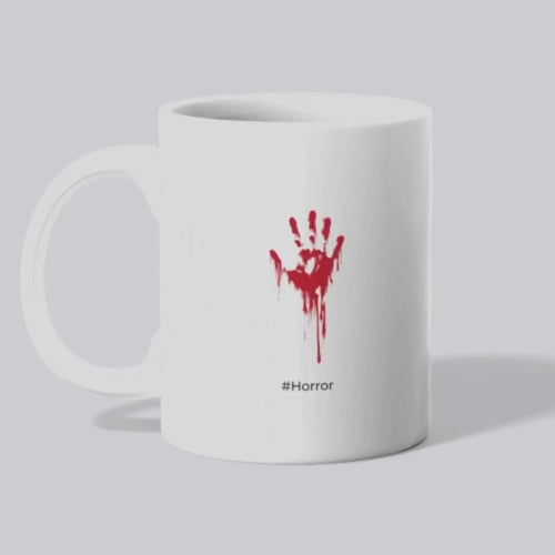 Horror with a bloody red hand on a white ceramic mug