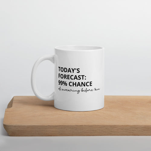 White ceramic mug with black text reading “Today’s forecast: 99% chance of swearing before 9am” – funny morning coffee mug.